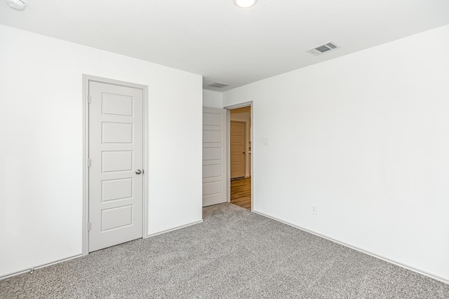 empty room featuring carpet floors