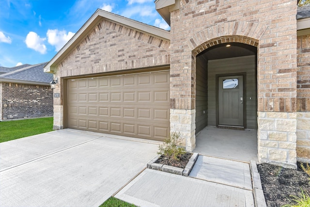 view of exterior entry featuring a garage