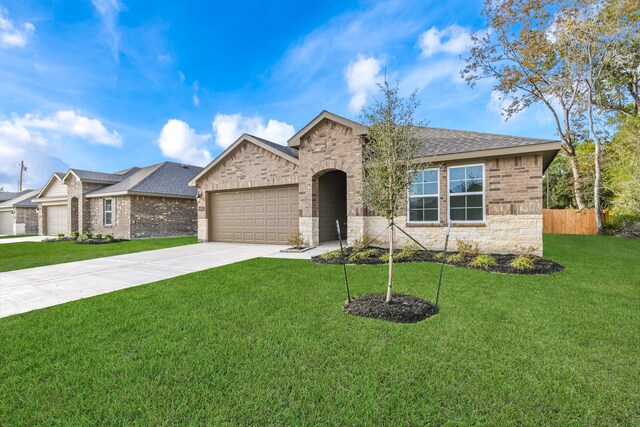 view of front of house with a garage and a front lawn