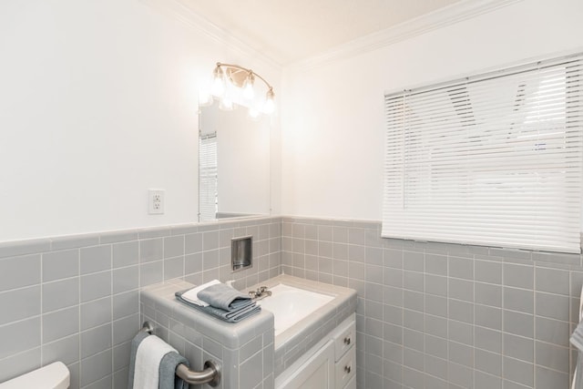 bathroom featuring vanity, toilet, crown molding, and tile walls