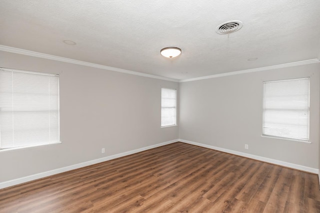 unfurnished room with a textured ceiling, dark hardwood / wood-style floors, and ornamental molding