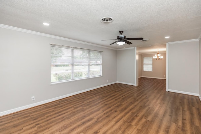 empty room featuring ceiling fan with notable chandelier, a textured ceiling, dark wood-type flooring, and ornamental molding