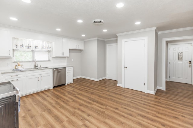 kitchen featuring range, sink, stainless steel dishwasher, decorative backsplash, and white cabinetry