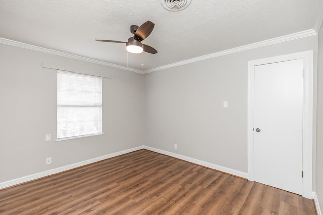 empty room with a textured ceiling, dark hardwood / wood-style floors, ceiling fan, and ornamental molding