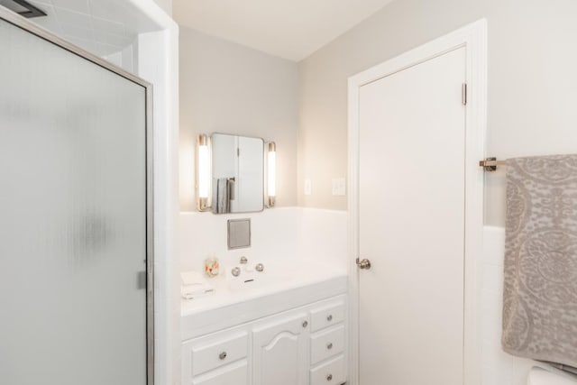 bathroom with vanity and walk in shower