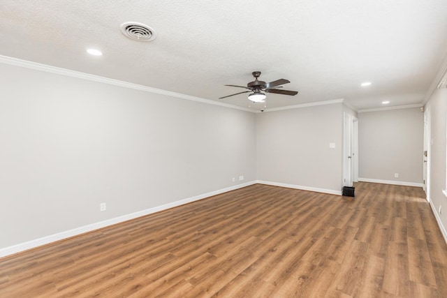 unfurnished room with a textured ceiling, hardwood / wood-style flooring, ceiling fan, and crown molding