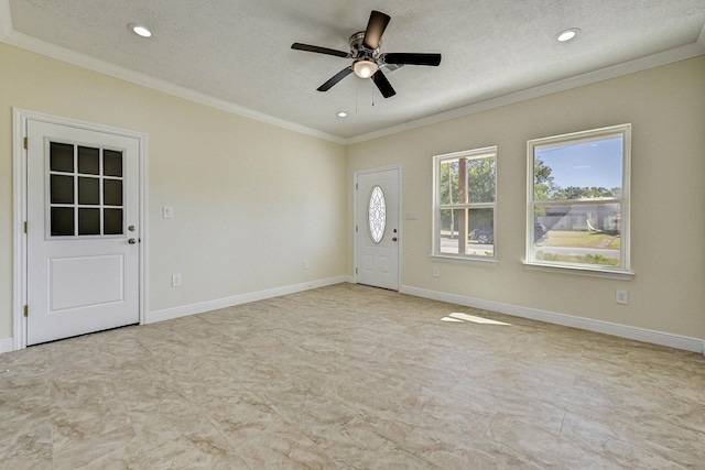 interior space featuring a textured ceiling, ceiling fan, and crown molding