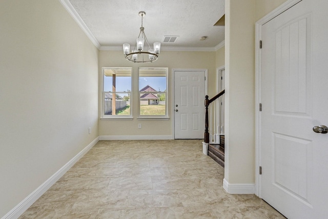 entryway featuring a textured ceiling, crown molding, and an inviting chandelier