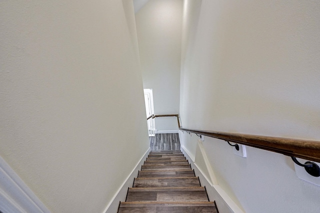 stairs with hardwood / wood-style floors