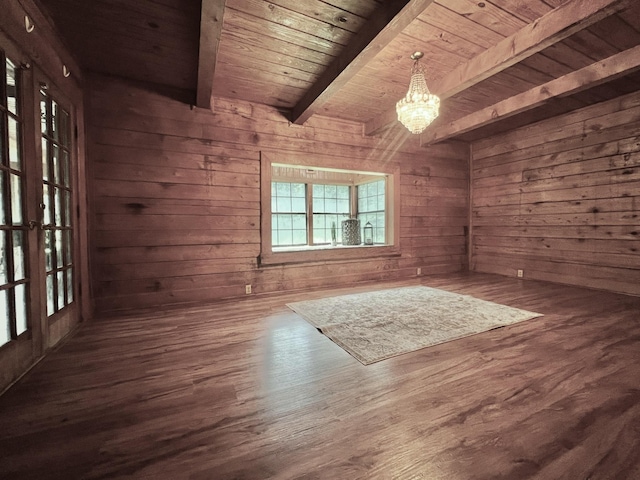 1205 Douglas St, Vidor, TX 77662 - empty room with a wood ceiling with exposed beams, wooden walls, a chandelier, and dark wood-style flooring
