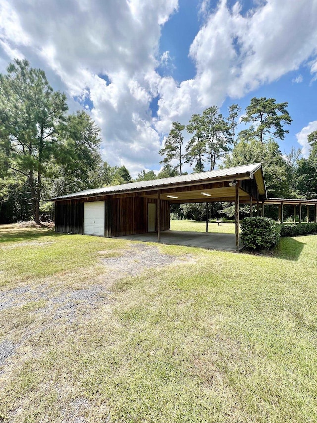 1205 Douglas St, Vidor, TX 77662 - view of outbuilding with driveway