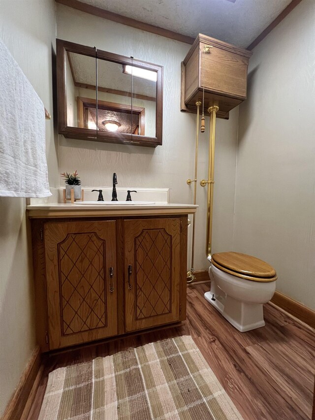 1205 Douglas St, Vidor, TX 77662 - bathroom featuring wood finished floors and vanity