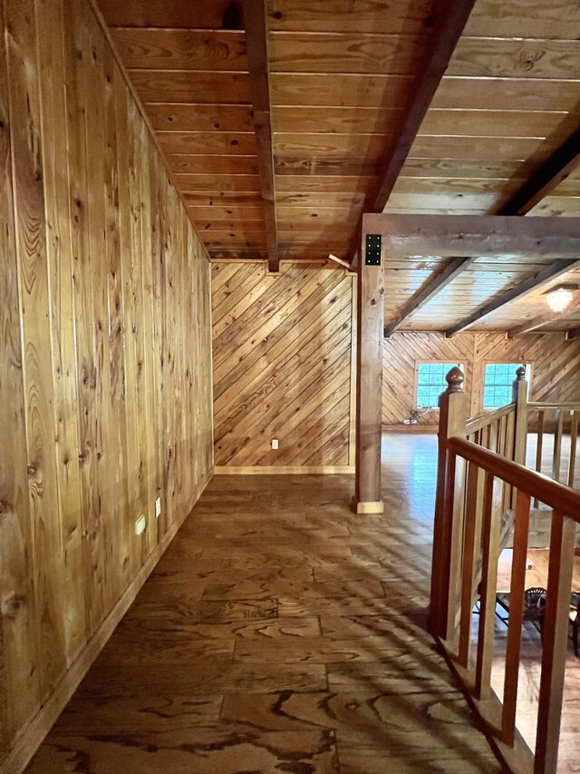 1205 Douglas St, Vidor, TX 77662 - corridor with wood walls, a wood ceiling with exposed beams, an upstairs landing, and wood-type flooring