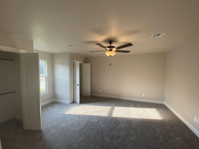 unfurnished bedroom featuring carpet and ceiling fan