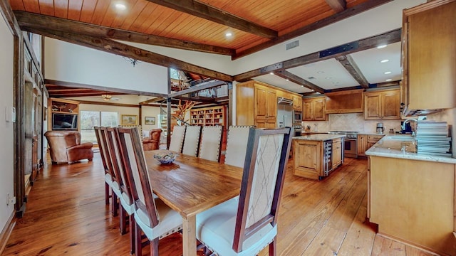 10309 Bussey Rd, Silsbee, TX 77656 - dining space with light wood-type flooring, wood ceiling with exposed beams, and recessed lighting