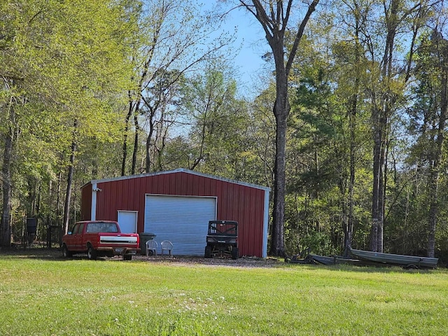 10309 Bussey Rd, Silsbee, TX 77656 - view of outbuilding featuring a forest view