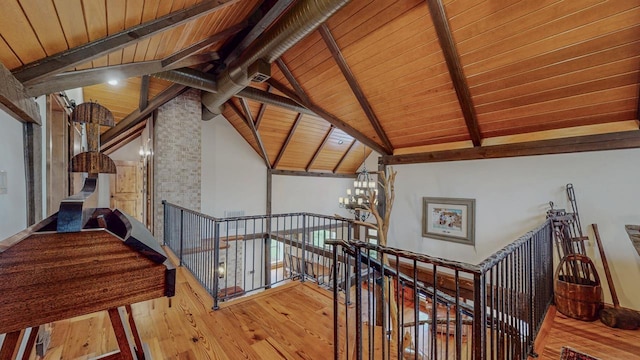 10309 Bussey Rd, Silsbee, TX 77656 - stairs featuring wood ceiling, hardwood / wood-style flooring, and a chandelier