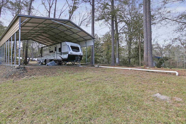 view of vehicle parking featuring a carport and a lawn