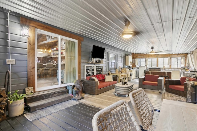 wooden terrace featuring ceiling fan