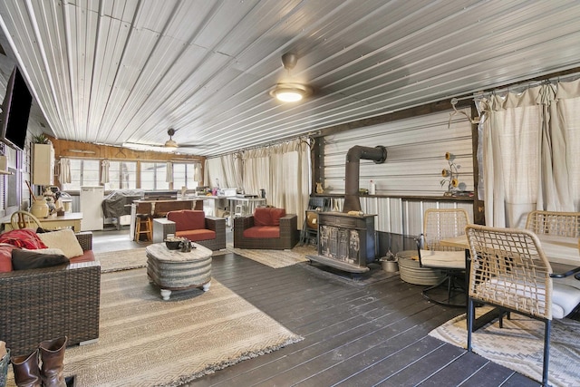 interior space with outdoor lounge area and ceiling fan