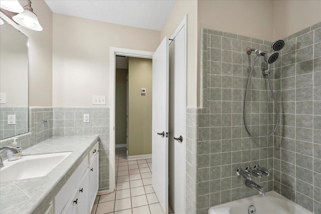 6250 Carnation Dr, Beaumont, TX 77706 - full bathroom featuring tile patterned floors, vanity, washtub / shower combination, tile walls, and a wainscoted wall