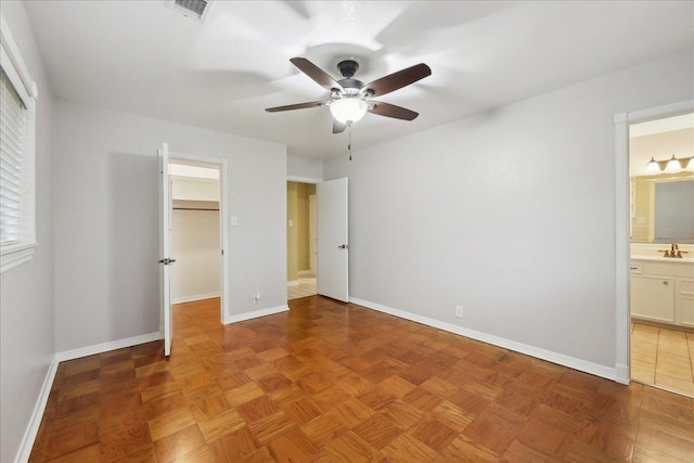 6250 Carnation Dr, Beaumont, TX 77706 - unfurnished bedroom featuring a sink, baseboards, and a spacious closet