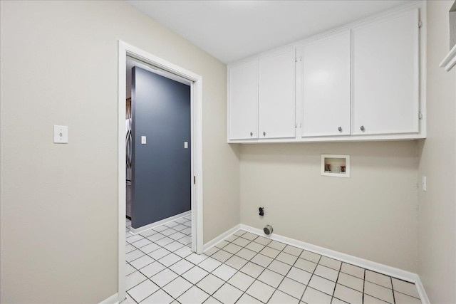 6250 Carnation Dr, Beaumont, TX 77706 - laundry room featuring cabinet space, washer hookup, baseboards, and light tile patterned floors