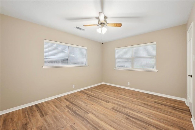 6250 Carnation Dr, Beaumont, TX 77706 - unfurnished room with healthy amount of natural light, light wood finished floors, ceiling fan, and baseboards