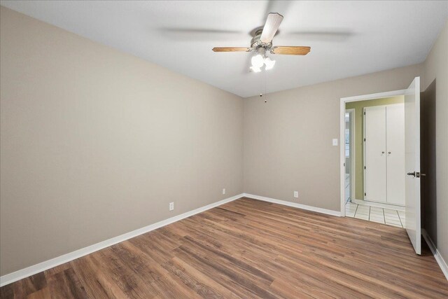 6250 Carnation Dr, Beaumont, TX 77706 - empty room with wood finished floors, ceiling fan, and baseboards