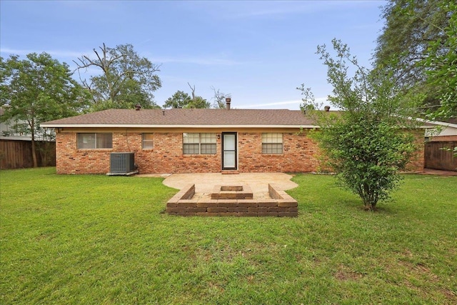 6250 Carnation Dr, Beaumont, TX 77706 - back of property featuring a patio area, central AC, and brick siding