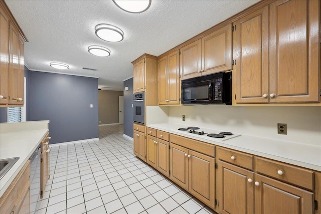 6250 Carnation Dr, Beaumont, TX 77706 - kitchen featuring black microwave, white electric cooktop, stainless steel oven, light countertops, and a textured ceiling