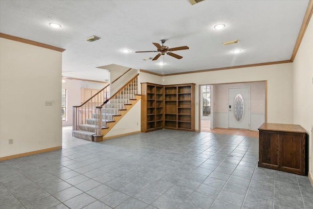 unfurnished living room featuring ceiling fan, a healthy amount of sunlight, and crown molding