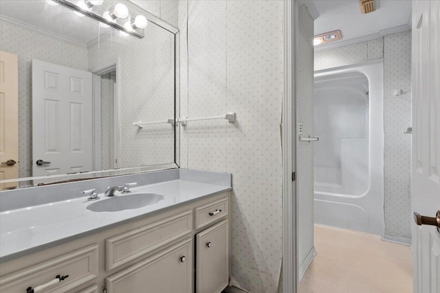 bathroom with crown molding and vanity