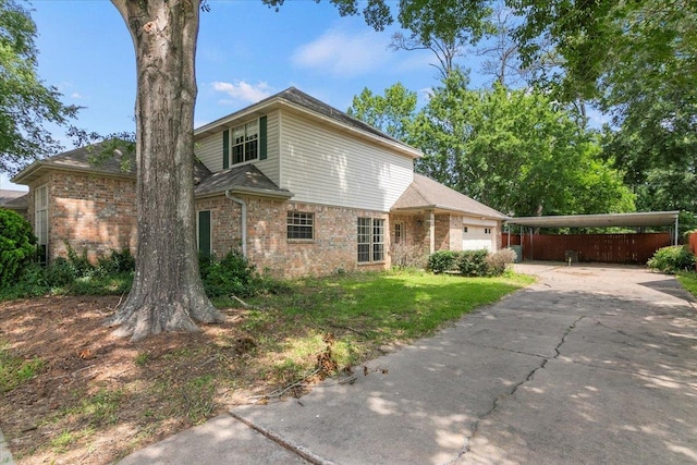 view of property featuring a carport and a garage