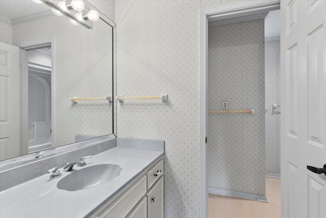 bathroom with vanity and crown molding