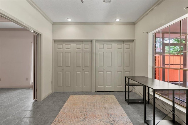 tiled home office with crown molding and a textured ceiling