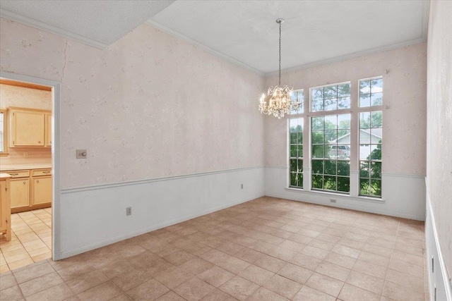 unfurnished room with a chandelier, light tile patterned floors, and ornamental molding