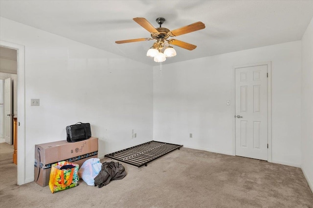 unfurnished room featuring light carpet and ceiling fan