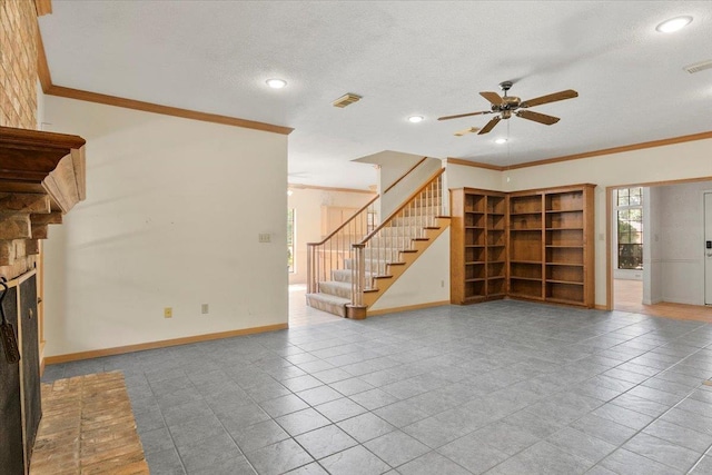 unfurnished living room with ceiling fan, a fireplace, and crown molding