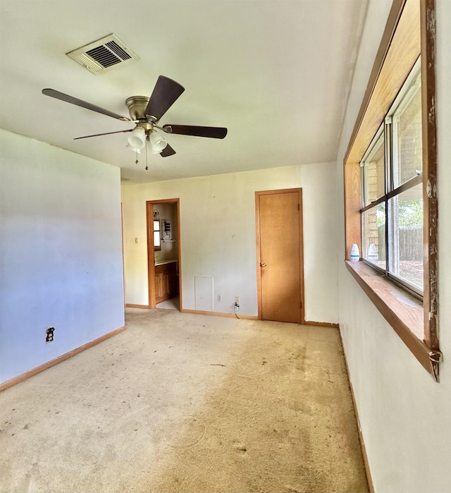 6219 16th St, Port Arthur, TX 77642 - spare room featuring light colored carpet, visible vents, baseboards, and a ceiling fan