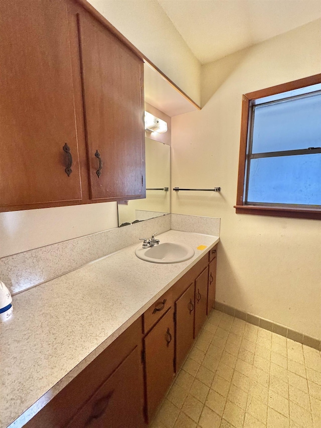 6219 16th St, Port Arthur, TX 77642 - bathroom with baseboards, tile patterned floors, and vanity