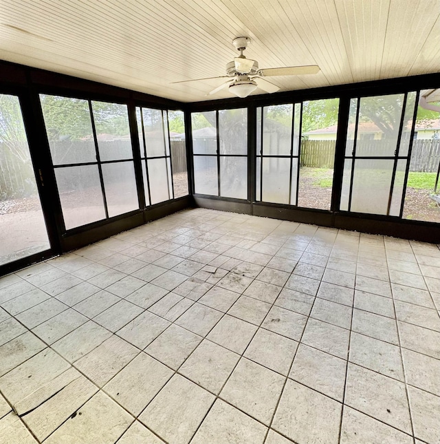 6219 16th St, Port Arthur, TX 77642 - unfurnished sunroom featuring ceiling fan and wood ceiling
