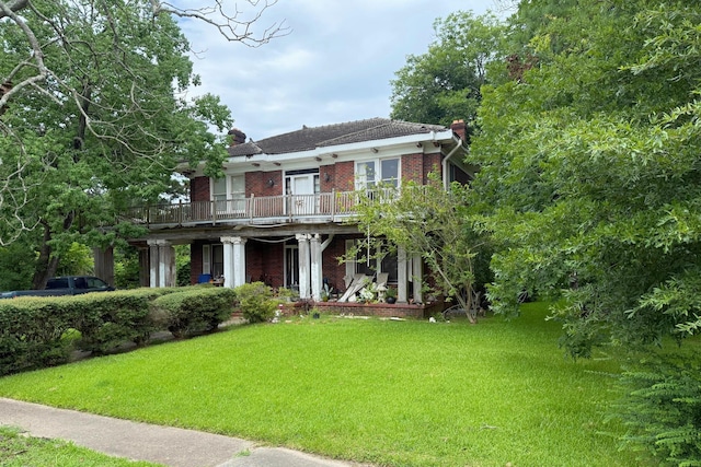 1010 Amarillo St, Beaumont, TX 77701 - view of front facade featuring brick siding, a front lawn, and a chimney