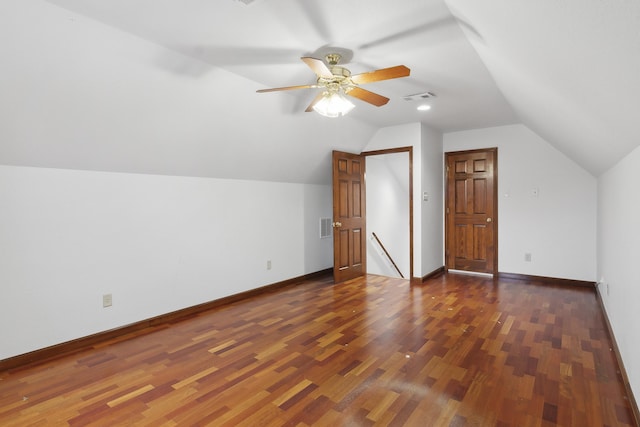 bonus room featuring vaulted ceiling, ceiling fan, and dark wood-type flooring