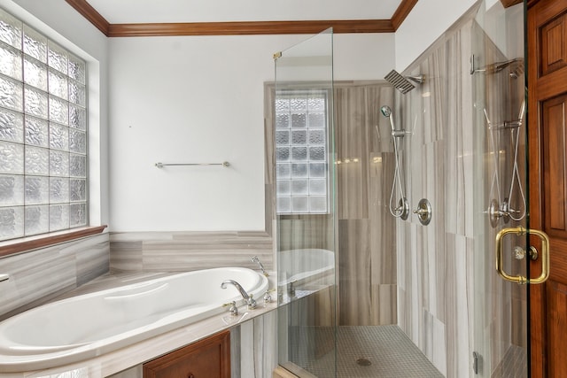 bathroom with separate shower and tub and ornamental molding