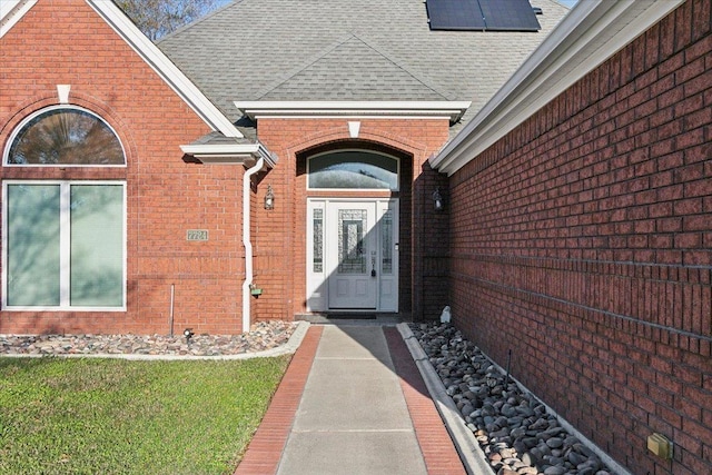 view of exterior entry with solar panels