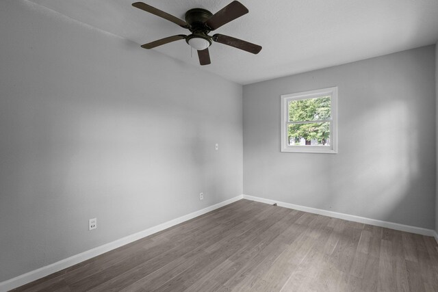 3015 Timberwood Ln, Beaumont, TX 77703 - empty room with wood finished floors, ceiling fan, and baseboards