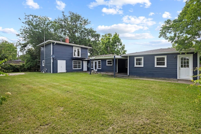 3015 Timberwood Ln, Beaumont, TX 77703 - back of property with a chimney and a yard