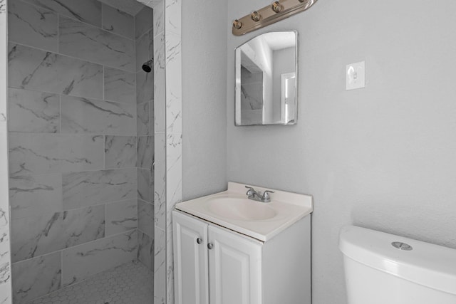 3015 Timberwood Ln, Beaumont, TX 77703 - bathroom featuring vanity, tiled shower, and toilet