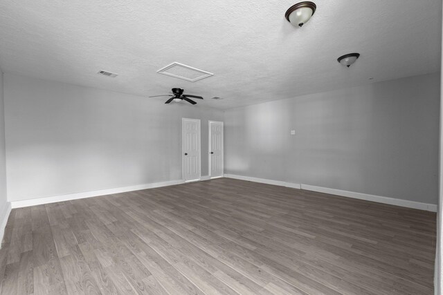 3015 Timberwood Ln, Beaumont, TX 77703 - empty room featuring a textured ceiling, wood finished floors, baseboards, and ceiling fan